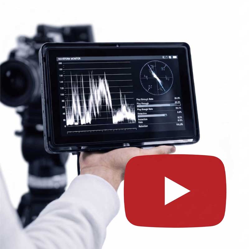 Close-up of a professional production waveform monitor displaying video analytics and retention graphs, representing a systematic approach to YouTube authority and video infrastructure.